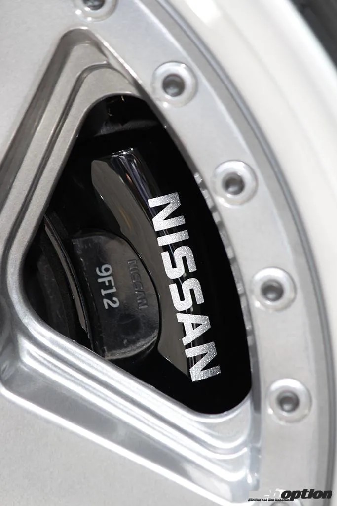 Close-up of the front brake caliper and rotor of a Nissan Gloria Gran Turismo Super SV