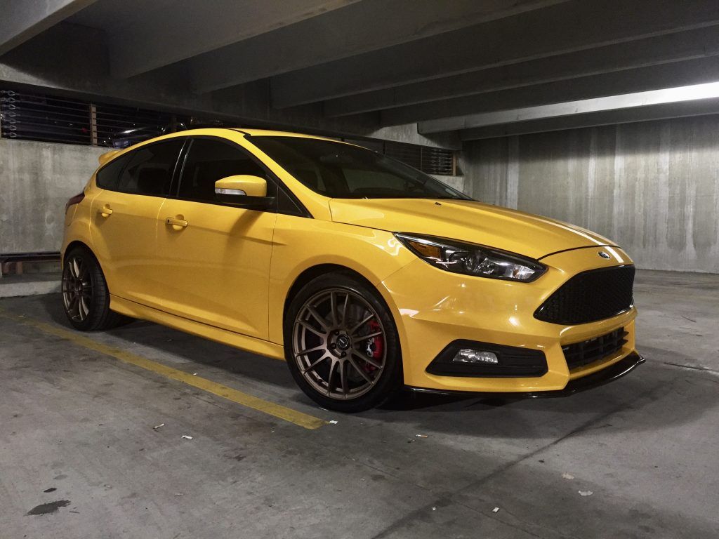 Modified yellow ford focus mk3 on Craiyon